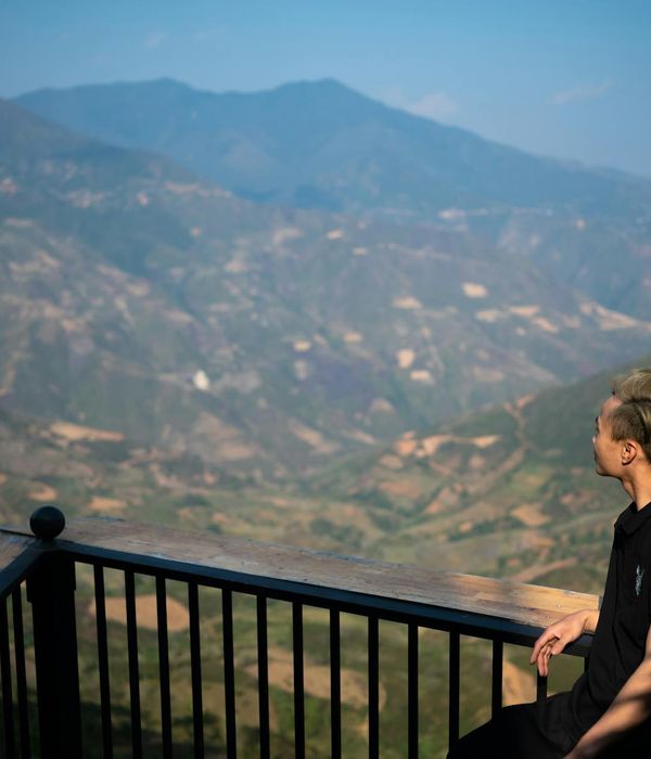 Person looking into the distance with a clear, focused gaze in a natural environment.